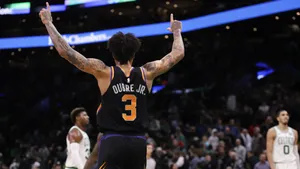 Kelly Oubre Jr Takes Flight On The Hardwood Wallpaper