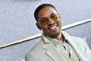 Kelvin Harrison Jr Smilingin Designer Suit Wallpaper