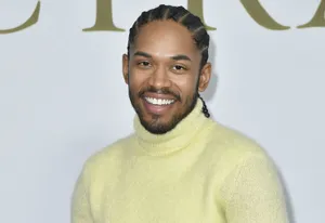 Kelvin Harrison Jr Yellow Turtleneck Smile Wallpaper