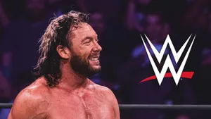 Kenny Omega Beside The Wwe Logo Wallpaper