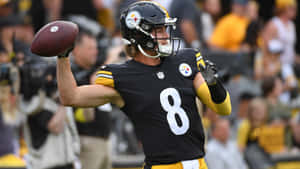 Kenny Pickett Steelers Quarterback Action Shot Wallpaper