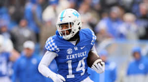 Kentucky Football Player14 In Action Wallpaper