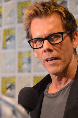 Kevin Bacon, The Renowned Hollywood Actor, Striking A Charismatic Pose Wallpaper