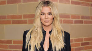 Khloe Kardashian Against Brick Wall Wallpaper