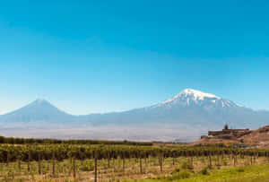 Khor Virap With Majestic Volcano Wallpaper