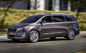 Kia Sedona 2022 Model Showcased In A Scenic Landscape Wallpaper