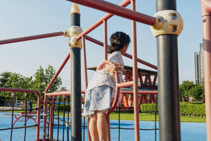 Kid On Playground Climbers Wallpaper