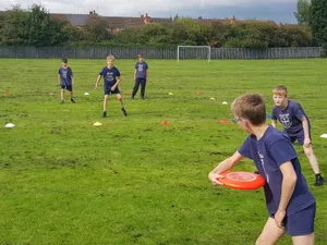 Kids Playing Ultimate Frisbee Wallpaper