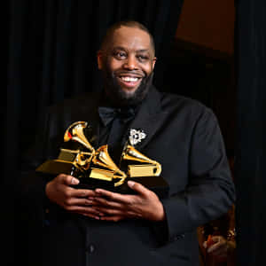 Killer Mike Holding Grammy Awards Wallpaper