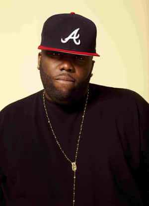 Killer Mike Portraitwith Atlanta Cap Wallpaper