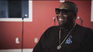 Killer Mike Smiling During Interview Wallpaper