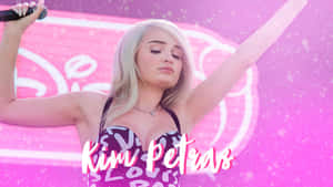 Kim Petras Rocking A Vibrant Outfit On Stage Wallpaper