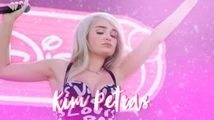 Kim Petras Rocking A Vibrant Outfit On Stage Wallpaper
