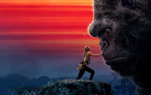 King Kong Movie Poster With A Woman Standing Next To A Gorilla Wallpaper