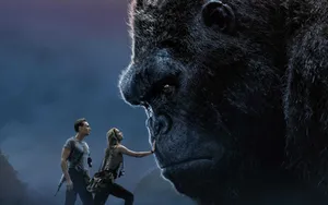 King Kong Roars As He Stands Atop A Skyscraper Wallpaper