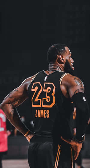 King Lebron James In Black Jersey Wallpaper