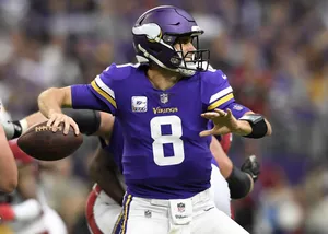 Kirk Cousins In Action: Mid-toss Moment Wallpaper