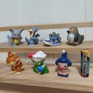 Klinklang And Other Pokémon Figurines Wallpaper