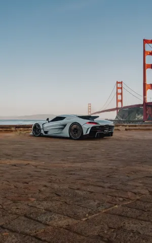 Koenigsegg Jesko Beside Golden Gate Bridge Wallpaper