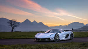 Koenigsegg Jesko Sunset Mountain Backdrop Wallpaper