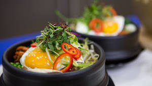 Korean Bibimbap With Peppers And Greens Wallpaper