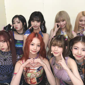 Kpop Group Heart Sign Pose Wallpaper