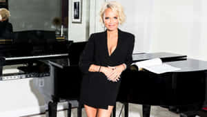 Kristin Chenoweth Radiates Charm In A Captivating Pose. Wallpaper