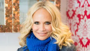 Kristin Chenoweth Striking A Pose In A Stunning Red Dress Wallpaper