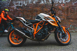 Ktm Duke 200 Near A Brick Wall Wallpaper