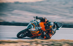 Ktm Rc 200 In Sharp Turn Wallpaper