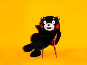 Kumamon On Pink Chair Wallpaper