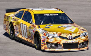 Kyle Busch's Vibrant Yellow #18 Nascar Racing Car Wallpaper