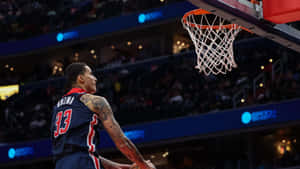 Kyle Kuzma Dunking Action Wallpaper