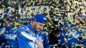 Kyle Larson Reveling In A Confetti Shower Victory Celebration Wallpaper