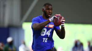 Kyle Pitts Catching Football During Practice Wallpaper