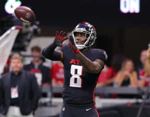 Kyle Pitts Catching Football Game Wallpaper