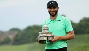 Kyle Stanley Holding A Trophy Wallpaper