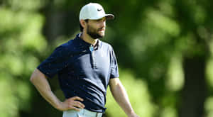 Kyle Stanley Standing On A Golf Field Wallpaper