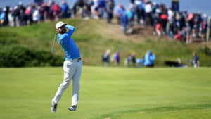 Kyle Stanley Swinging At A Golf Tournament Wallpaper