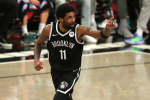 Kyrie Irving In Action For The Brooklyn Nets Wallpaper