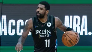 Kyrie Irving Leading The Brooklyn Nets To The Top Of The Nba Wallpaper