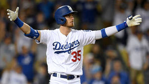 L.a. Dodgers Cody Bellinger Spread Arms Wallpaper