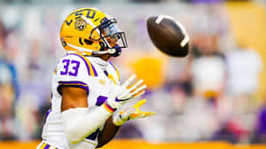L S U Football Player Catching Ball Wallpaper