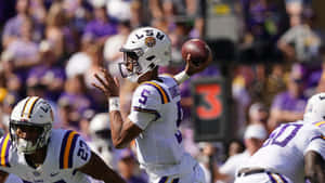 L S U Quarterback Prepares To Throw Football Wallpaper