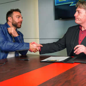 La Knight And Triple H Celebrating A Thrilling Wrestling Moment Wallpaper