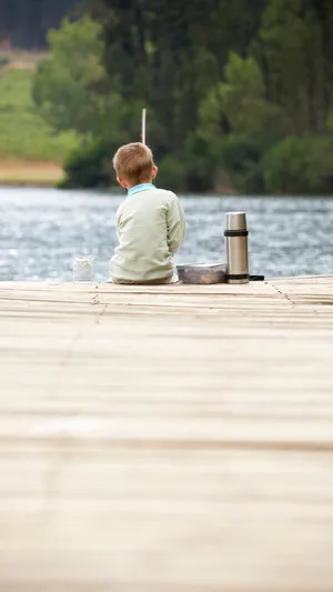 Lakeside Contemplation Boy Wallpaper