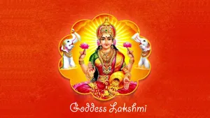 Lakshmi Devi Orange Background Wallpaper