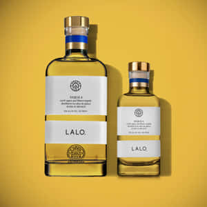 Lalo Tequila Bottles Yellow Background Wallpaper