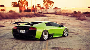 Lamborghini Murciélago Cruising Down The Urban Street Wallpaper