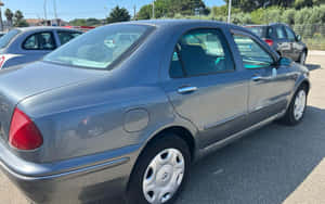 Lancia Lybra Sedan Parked Outdoors Wallpaper